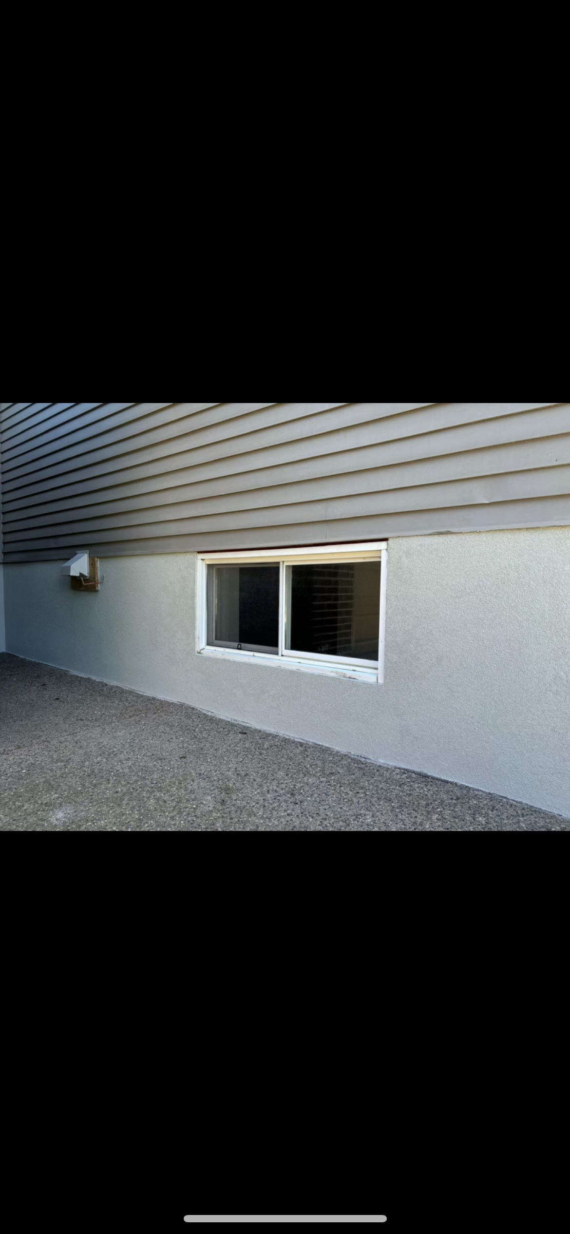 Professional parging application on foundation wall