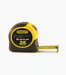 A yellow and black Stanley FatMax 25-foot tape measure The tape measure has the Stanley logo and FatMax branding prominently displayed It appears to be a durable heavy-duty tool commonly used for construction home improvement or DIY projects