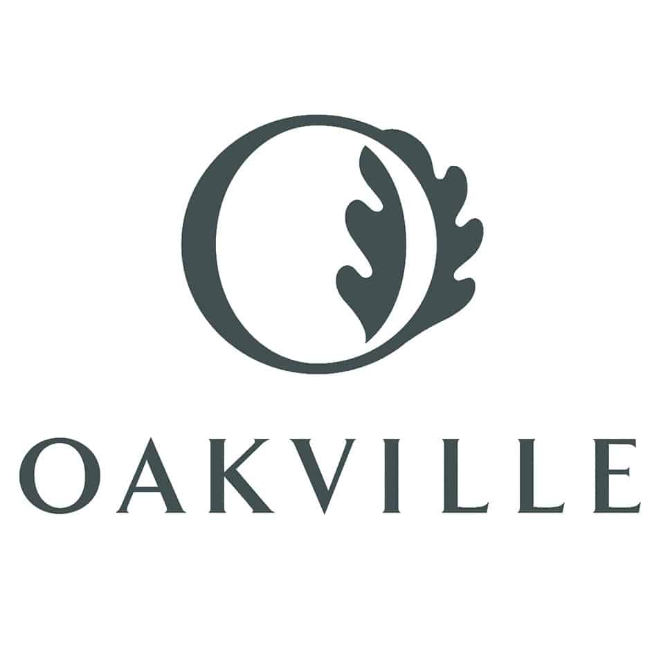 This image shows the logo for Oakville a stylized design featuring a circular shape with a leaf-like element inside it The text OAKVILLE is displayed in a bold clean font below the circular logo