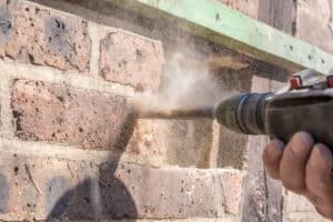 How to drill into brick