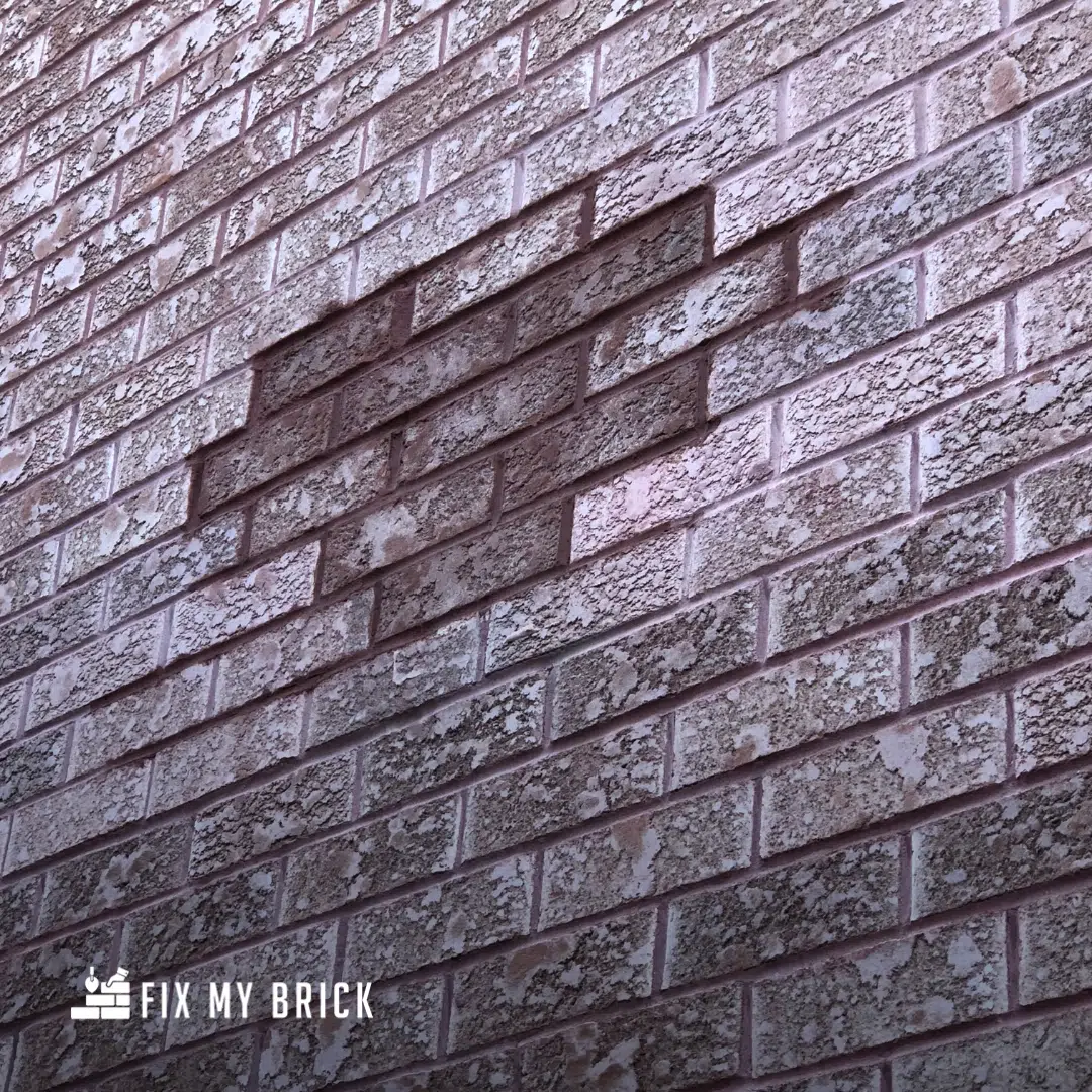 This image shows a close-up view of a brick wall The bricks have a rough textured surface and appear to be a grayish-brown color The bricks are arranged in a staggered pattern creating a visually interesting and irregular pattern across the wall The overall image conveys a sense of solidity and durability which is fitting for the website of a masonry company called Fix My Brick