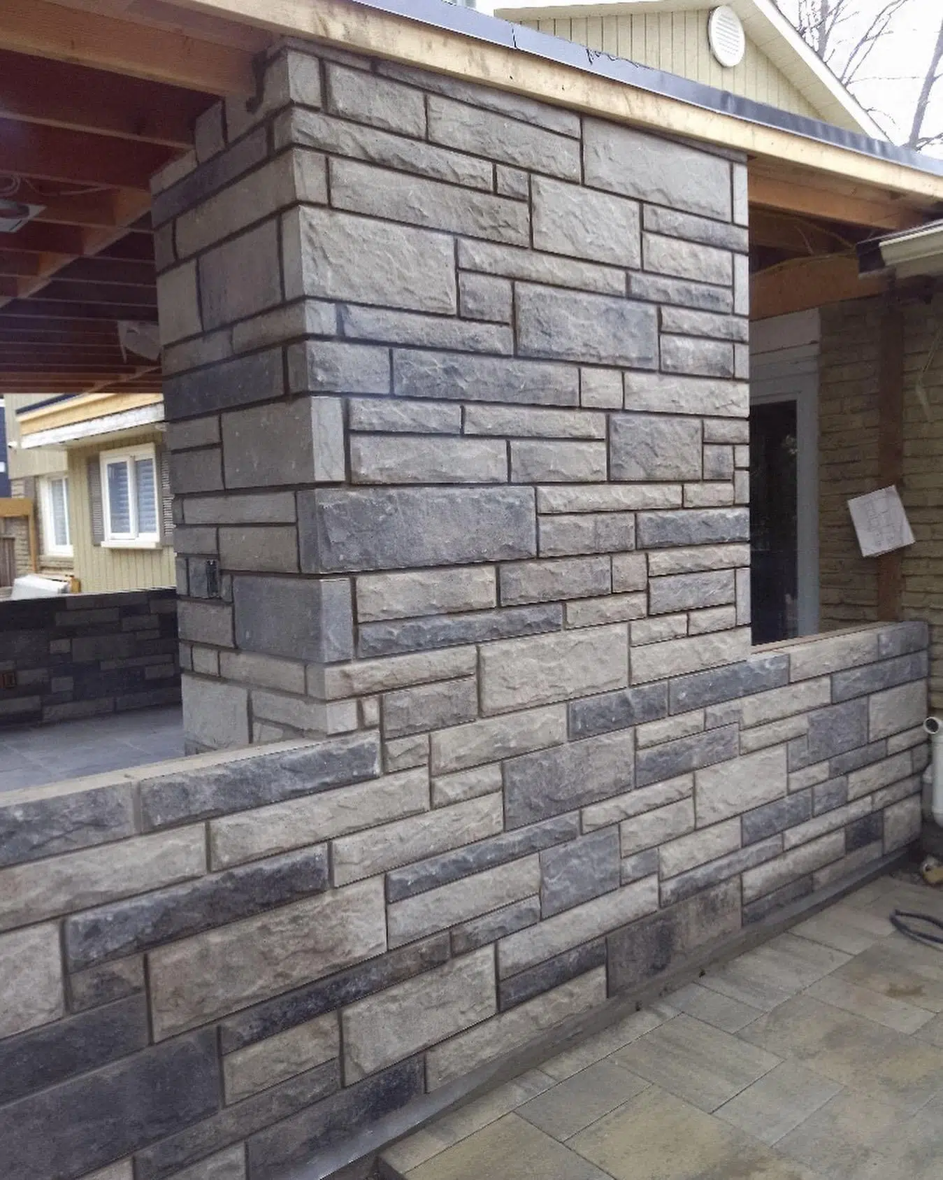 Stone veneer wall under construction